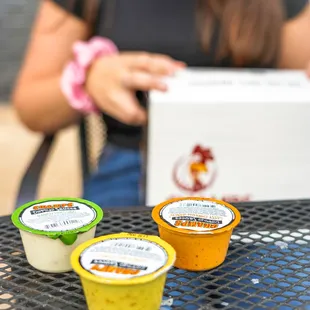 a woman holding a box of yogurt