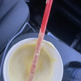 person holding a spoon in a cup