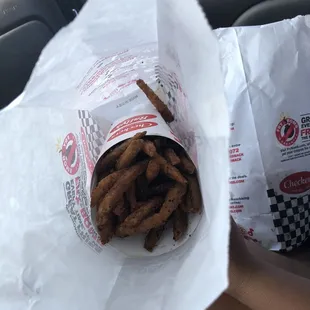 Burnt fries, grease particles and bottom Of the fryer particles