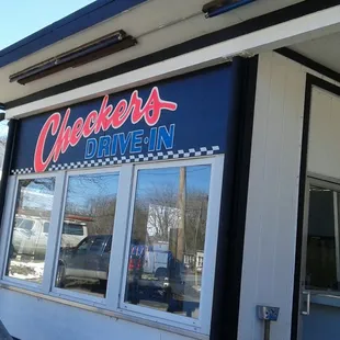 a man standing outside of a restaurant