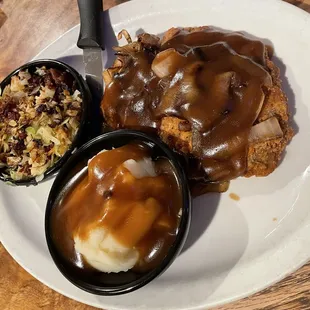 Country fried steak with grilled cabbage and mashed potatoes
