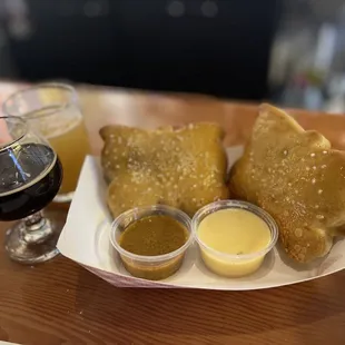 a plate of food and a glass of beer