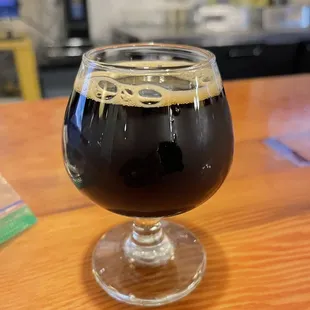 a glass of beer on a table