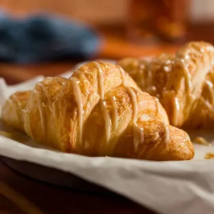 Our Honey Butter Croissants are baked to a golden brown and drizzled with house-made honey butter.