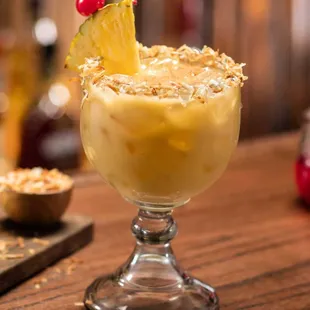 Cheddar’s Painkiller: Pusser’s rum, cream of coconut, pineapple juice, orange juice, toasted coconut rim, topped w/nutmeg. Limit 2 per guest