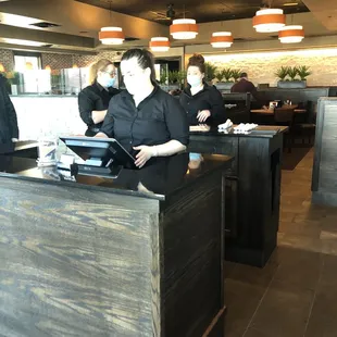 a woman standing at the counter