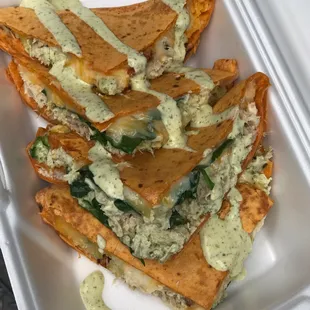 Pesto chicken quesadilla in a Roma tomato tortilla.