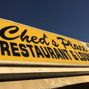 a sign for cheds bar and grill