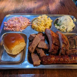 Combo plate with coleslaw, mac and cheese, and potato salad