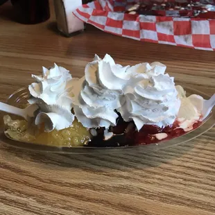 a banana split with whipped cream