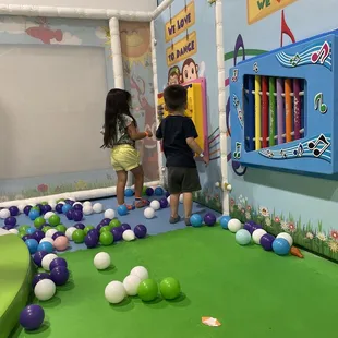 My baby boy playing with the wall toys