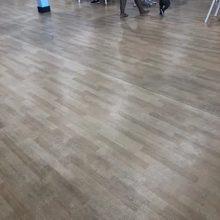 Bare feet coming from toddler play area.