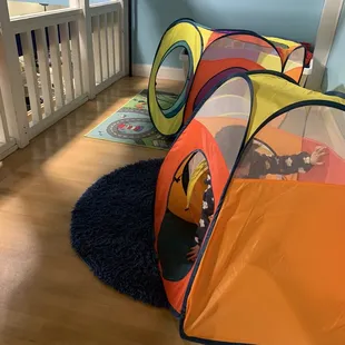 Upstairs above store front area is a tunnel and giant legos