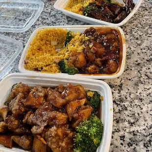 Bottom is Orange Chicken, middle is General Tso Chicken combo and top is C23. Bourbon Chicken Combination Plate