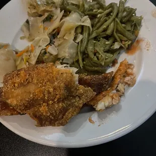 a plate of food with meat and vegetables