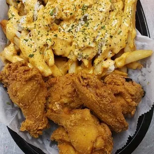 Fried Wings &amp; Crab Fries topped with our famous housemade Cheers Sauce