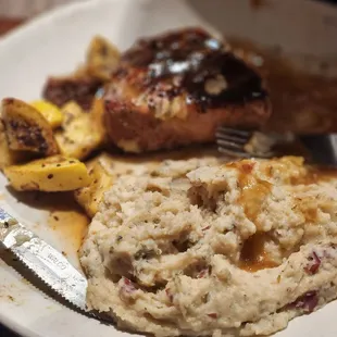 Pork Chop, mashed potatoes, and squash.