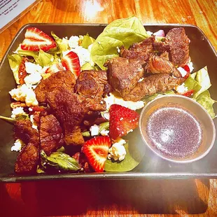 The steak &amp; strawberries on this impeccable salad are as delectable as they are picturesque!