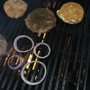 hamburgers and burgers on a grill