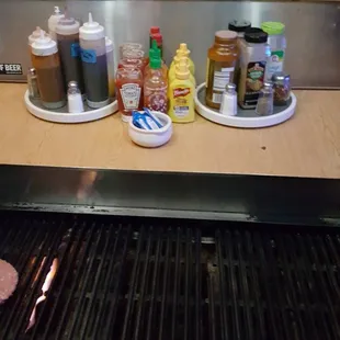 Prep area with seasonings and sauces