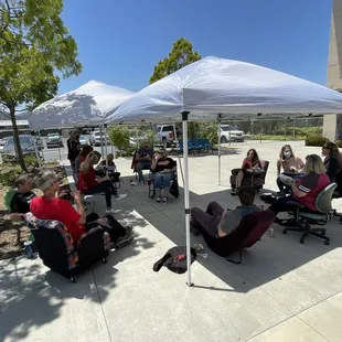 The staff socially-distanced eating and enjoying the appreciation