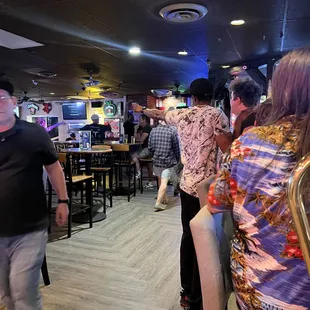 a group of people sitting in a restaurant