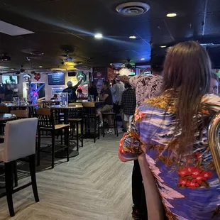 a woman sitting at a bar