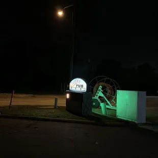 a neon sign in the dark