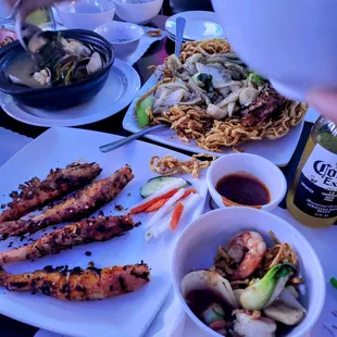 Clams in lemongrass broth, seafood pan-fried noodle, and grilled prawns skewers.