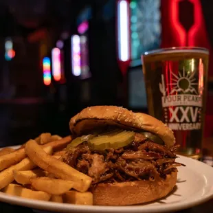 a plate of food and a glass of beer