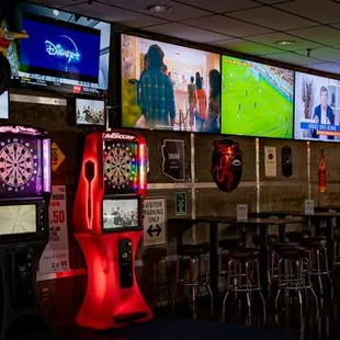 a bar with darts, darts, darts, darts, and darts