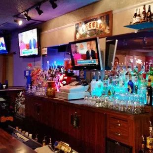 a bar with a lot of liquor bottles