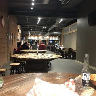 a view of a restaurant with tables and chairs