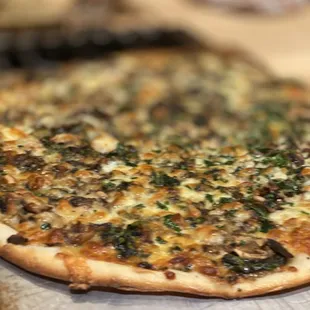 a pizza on a wooden board
