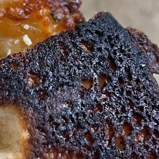 Really burnt crust. Surprised they served this.