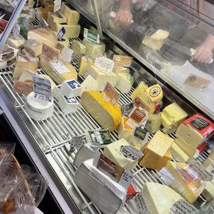 a variety of cheeses on display