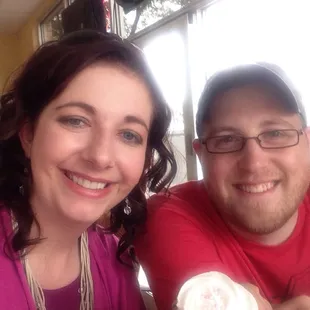 White cake cupcake with raspberry cheesecake center and white frosting