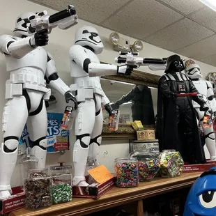 a shelf of star wars merchandise