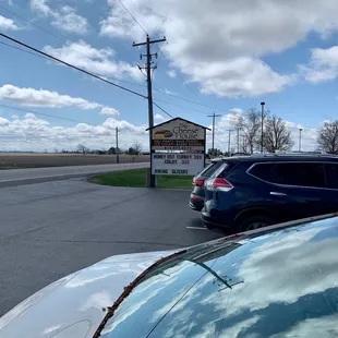 the reflection of a car in a parking lot