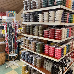 a variety of cheeses on shelves