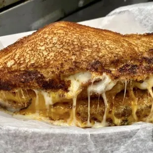 The Bourbonator, out top seller, homemade bourbon bacon jam, bacon, cheddar and mozzarella cheese.