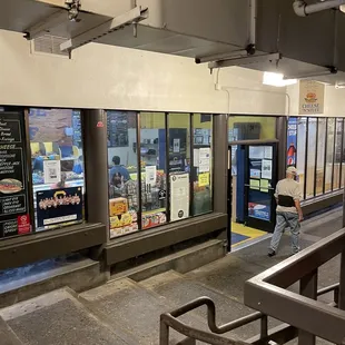 man standing in front of a store
