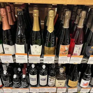 a shelf full of wine bottles