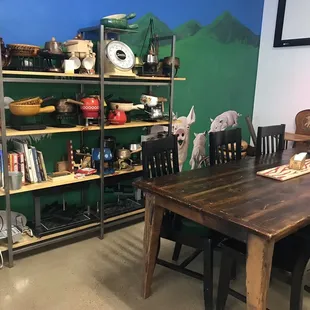 Lots of fun fondue pots and books (not sure these are for sale?) and a community table.