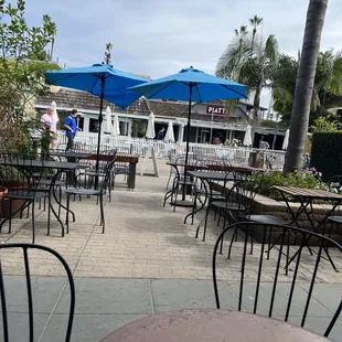 tables with umbrellas and chairs