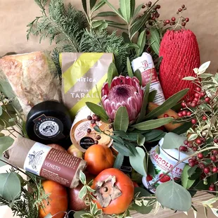 Medium Gift Basket with Cheese, Salami, Nuts, Fresh Fruits, Dried Fruits, Ciabatta, Crackers, Jam and Flowers