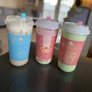 Signature milk tea w/cheese cap, strawberry milk team with  creamy cake foam, honeydew melon smoothie.