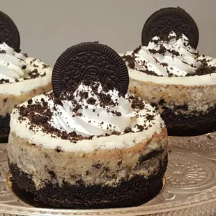 three oreo cheesecakes on a silver platter
