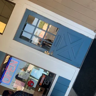 the reflection of a man in the window