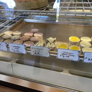 a variety of cheesecakes on display